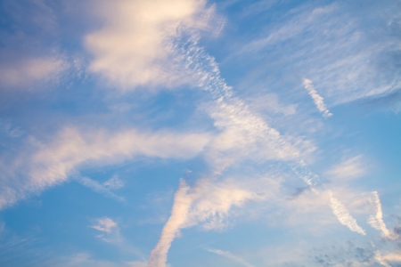 clear blue sky with different white cloudsの写真素材