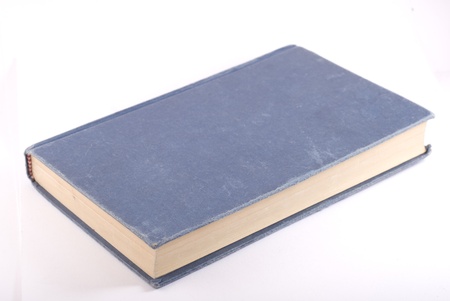 Old blue book isolated on white. Diagonal composition.の写真素材