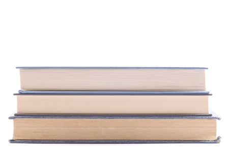 Three books in a center weighted pile. Horizontal composition. Above space for your text or graphics.の写真素材