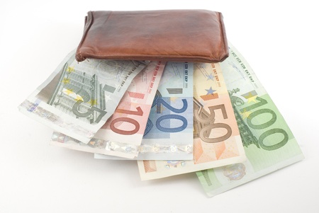 Wallet full of euro banknotes. Isolated on white.の写真素材