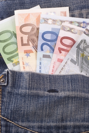 Euro banknotes in jeans pocket. Bills from 5 to 100 euros.の写真素材
