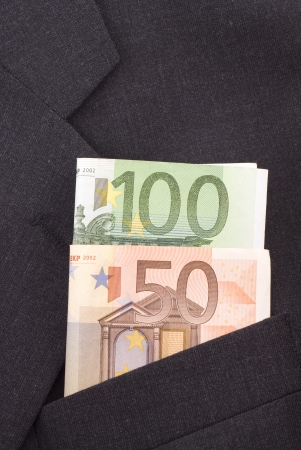 Euro banknotes in the pocket of a dark suit.の写真素材
