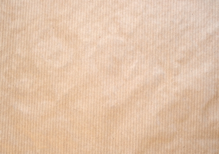Frontal image of a brown striped paper ackground.の写真素材