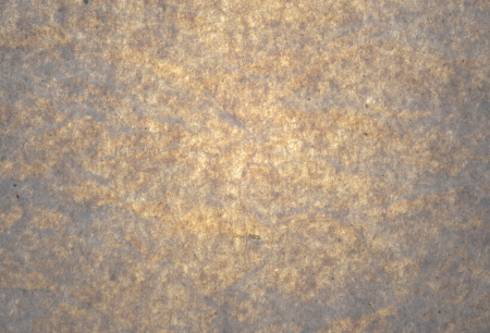 Brown paper with bright center and darker corners.の写真素材