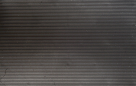 Dark horizontally striped rubber background. の写真素材
