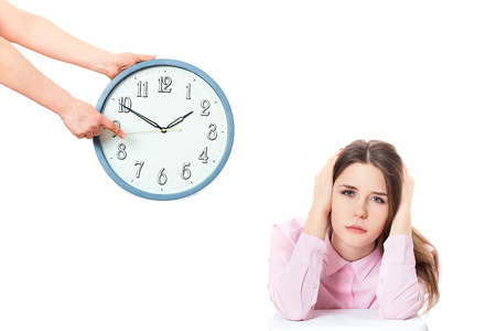 woman is holding in hands clock.の写真素材