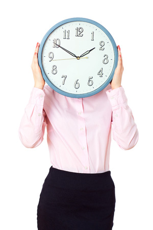 Woman holding a large clock faceの写真素材
