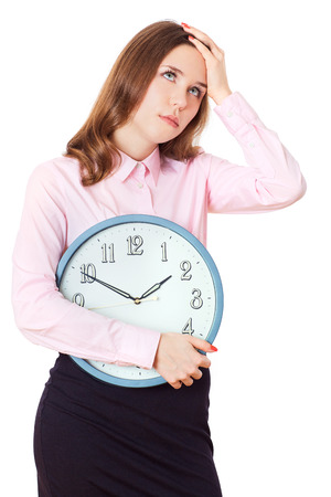 Businesswoman is holding in hands clock.の写真素材