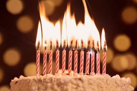Cake shot on a bokeh background with candles.の写真素材