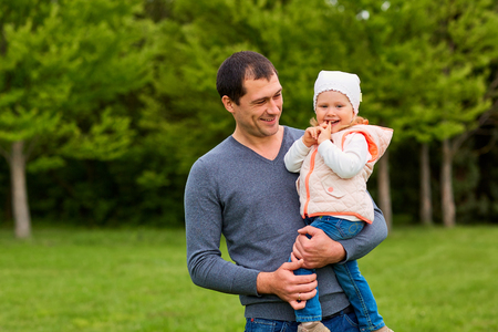 Happy father and daughter in the park. Smiling,laughing and happiness.の写真素材