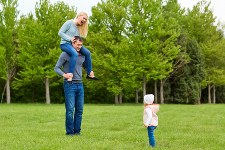 A happy family. Funny moment.Mama in the hands of the pope. Laugh, smile.の写真素材