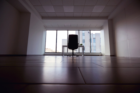 Chair and table in empty modern office.の写真素材