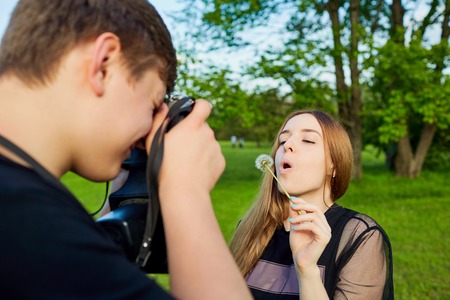 A loving couple is photographed in the park.の写真素材