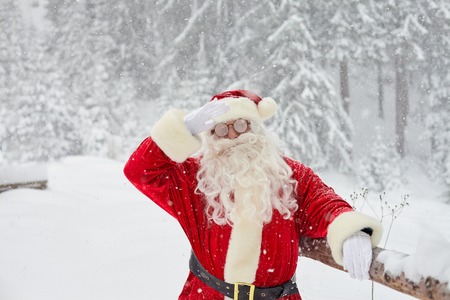 Santa Claus on snow in winter at Christmas.の写真素材