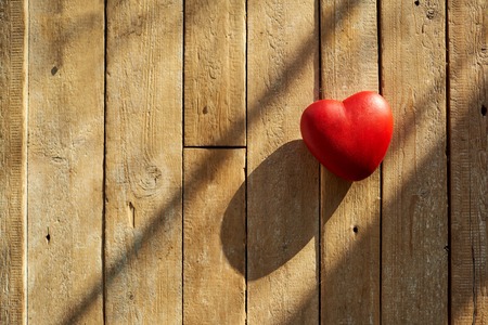Red heart on a wooden background. Valentines Day.の写真素材