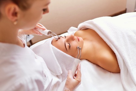 Woman on facial skincare procedure.Hardware cosmetology.