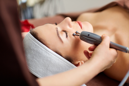 Hardware treatments in the spa salon. Young woman at the cosmetician in the spa room.の写真素材
