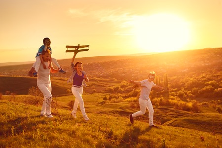 Happy family with nature in the evening at sunset.の写真素材
