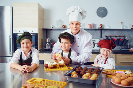 Children learn to cook in the classroom in the kitchen.の写真素材