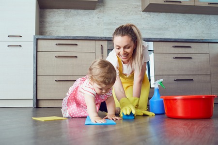 Mother and baby are cleaning the house.の写真素材