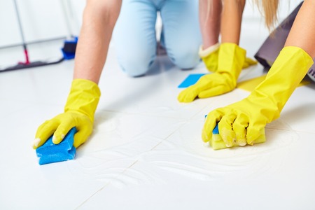 Cleaning, washing. A close-up of hands with gloves on cleaning the house.の写真素材