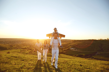 Happy family with nature in the evening at sunset.の写真素材