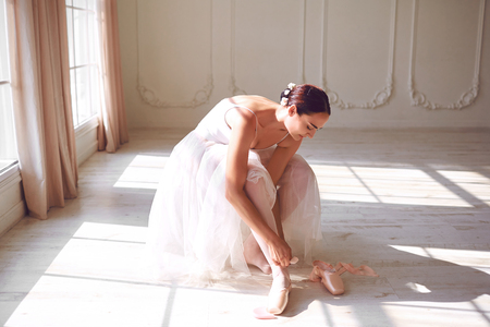 Ballerina wearing pointe shoes in the room.の写真素材