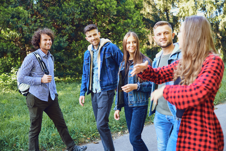 Happy friends walking are laughing at the park. Friendship of young people. Lifestyleの写真素材