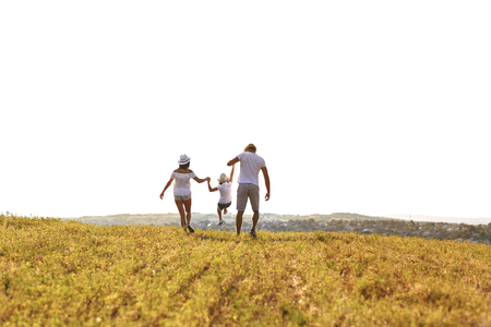 Happy family walking in nature in summer, autumn.の写真素材