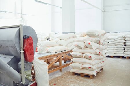 Bags of flour in the warehouse of the factory.の写真素材