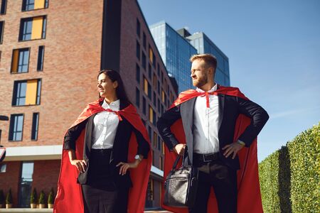 Business people super heroes walk along the city street. Business concept super hero success.の写真素材