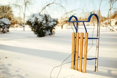 Winter sled in the snow in the winter park.の写真素材