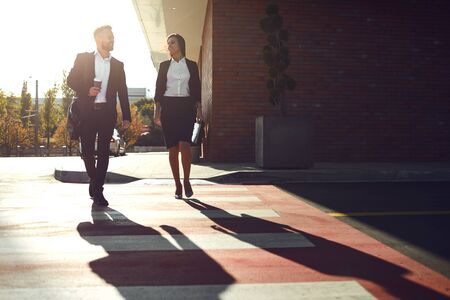 Business People walk along the city street. Concept success business meeting work professional.