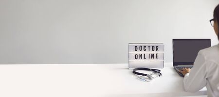 Online doctor concept. Doctor online medical help having a patient video call at home.の写真素材