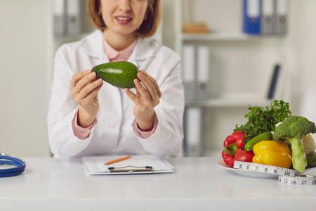 Nutritiologist online, weight loss, clean eating concept. Woman doctor nutritiologist holding...