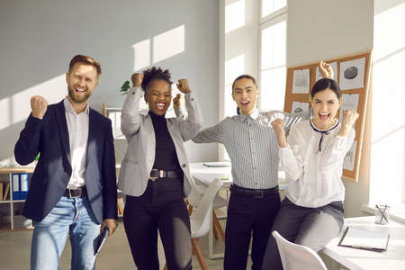 Success, business development, international team concept. Group of young cheerful people...