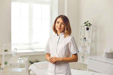 Cosmetologist in the cosmetology office. Cosmetologist doctor dermatologist in a beauty clinic. Facial skin treatment. Beauty treatments.の写真素材