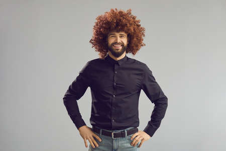 Have a Good Hair Day. Portrait of a positive guy with a crazy hairstyle. Funny happy young man...