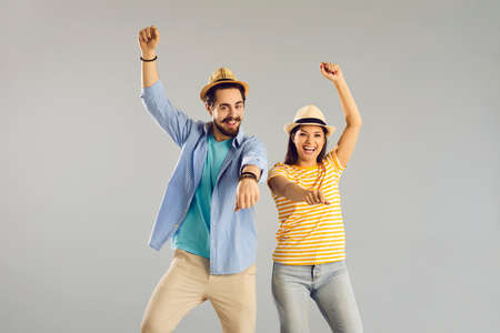 Funny happy joyful couple traveler cowboy riding horse impersonator having fun and cheering...
