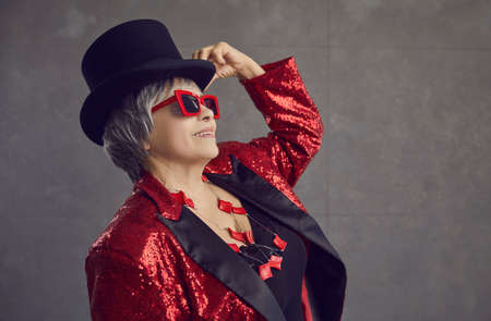Funny positive youthful looking grandma having fun. Happy smiling stylish retired senior woman in...