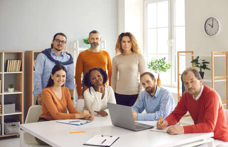 Corporate training. Confident and successful people group business team diverse community having...