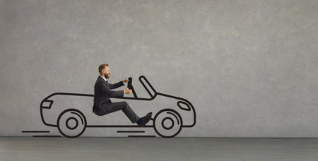 Side view of funny excited young man driving imaginary car of his dream. Happy confident businessman...