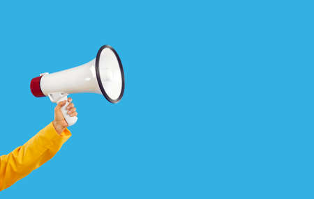 Woman yelling through megaphone. Young lady with amplified voice sharing important information....