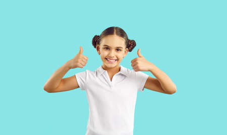 Happy kid. Joyful child in cotton tennis tee says Well done, Yes, Okay, Excellent, Perfect. Girl in...