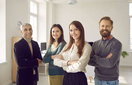 Group portrait of smiling diverse businesspeople pose together show leadership and unity at...