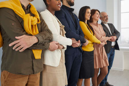 Together we stand. Diverse team of different happy, smiling young and senior multiethnic business...