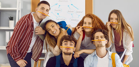 Students having fun together. Group portrait of funny school, college or university friends. Bunch...