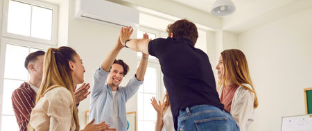Team of school students achieving goal together. Group of happy cheerful joyful friends smiling and...