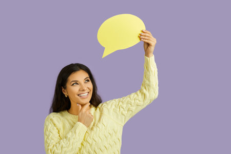 Let me think about it. Doubtful caucasian dark haired girl wearing yellow sweater holding and...