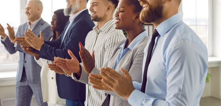 Audience applauding during meeting, business seminar or presentation in office. Cropped shot of...